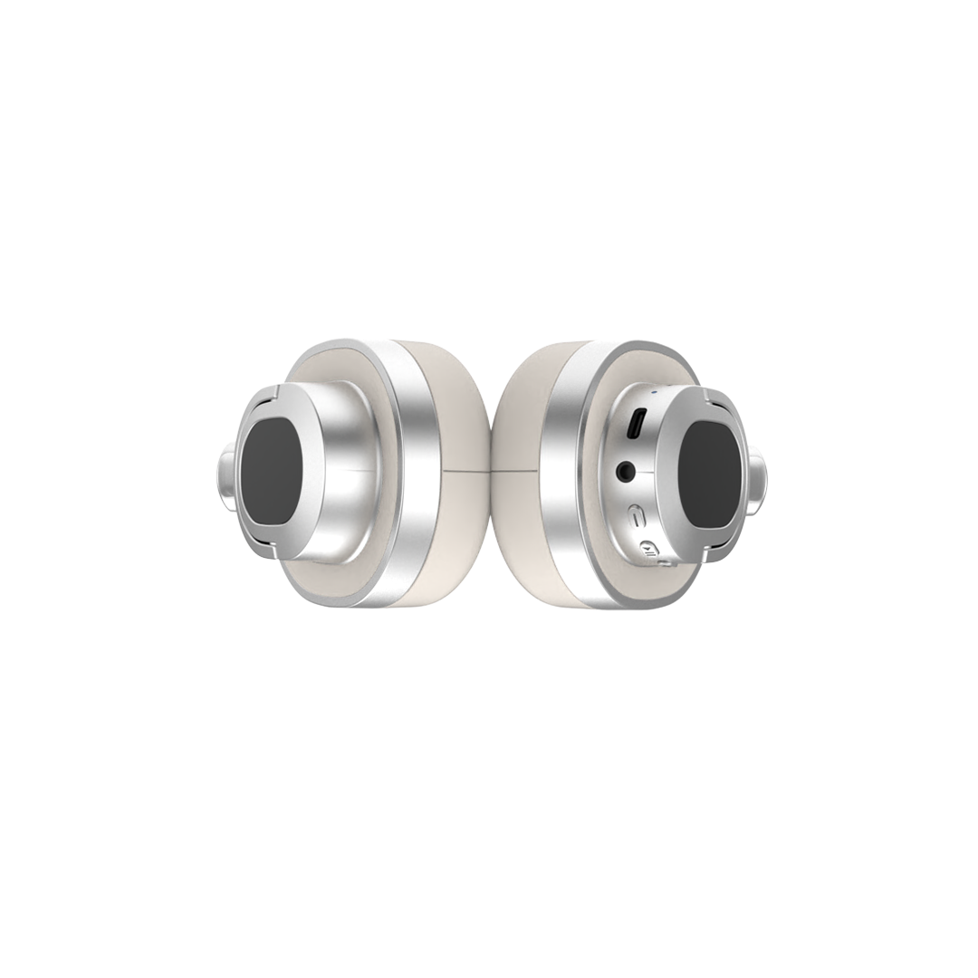 Groove Studio White headphones, earcups folded flat showing the USB-C charging port, 3.5mm AUX jack and control buttons